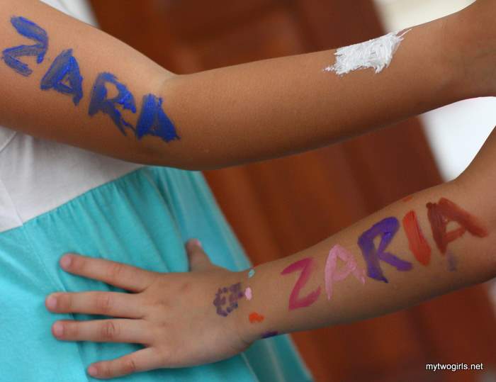 Zara and Zaria with arms painted